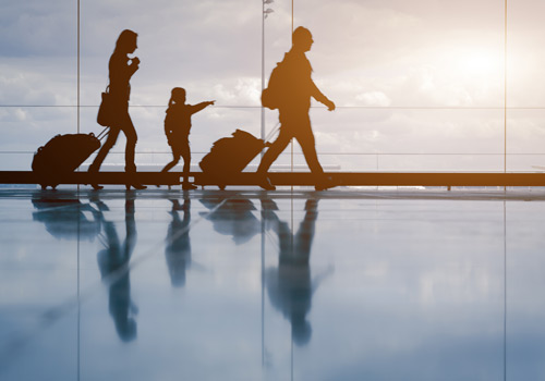 travelers walking in airport